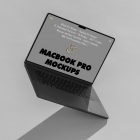 Front view, space gray MacBook Pro Mockup with gray design standing on the bright gray floor and hole background.