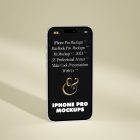 Front view, iPhone 14 Pro Mockup with black design standing on the bright gold floor.