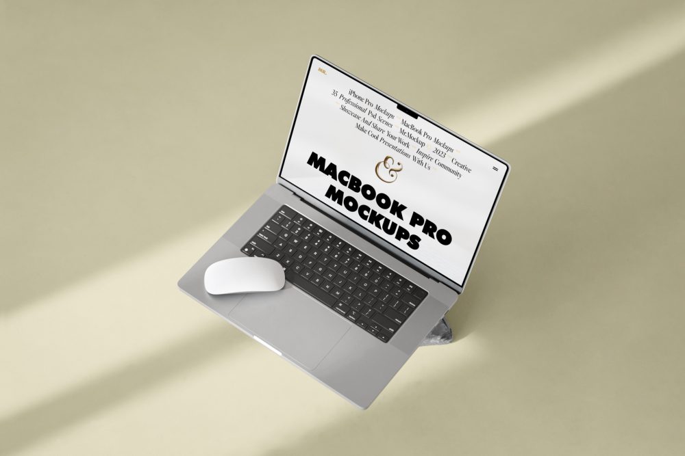 Seen from above, MacBook Pro Mockup with white design standing on the rock laying on the bright gold floor.