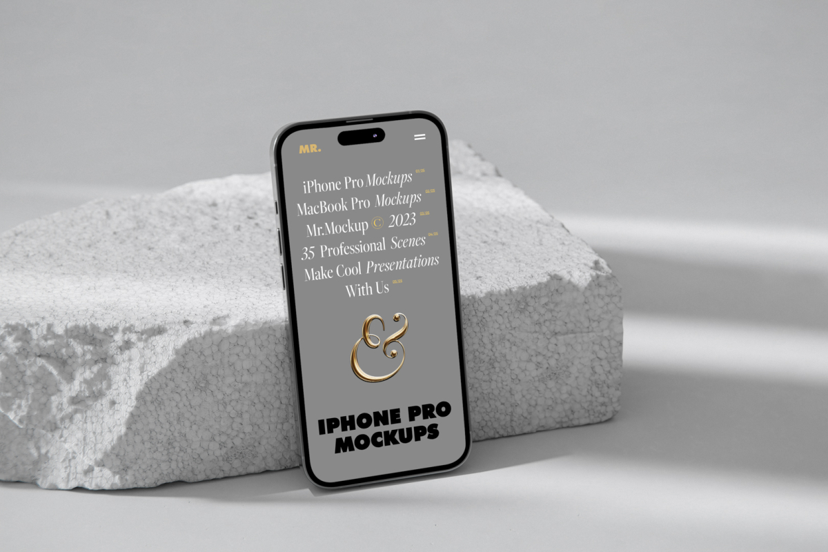 Front view iPhone 14 Pro Mockup with gray design based on the piece of a styrofoam and standing on the white floor against white wall.