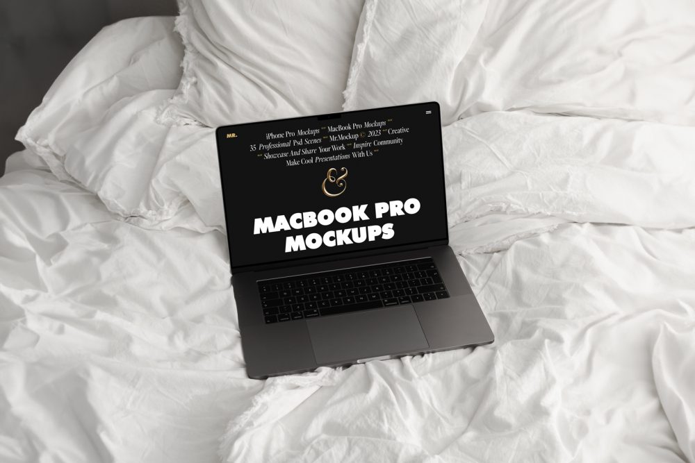Front view MacBook Pro Mockups with black design laying on the white linen on bed.