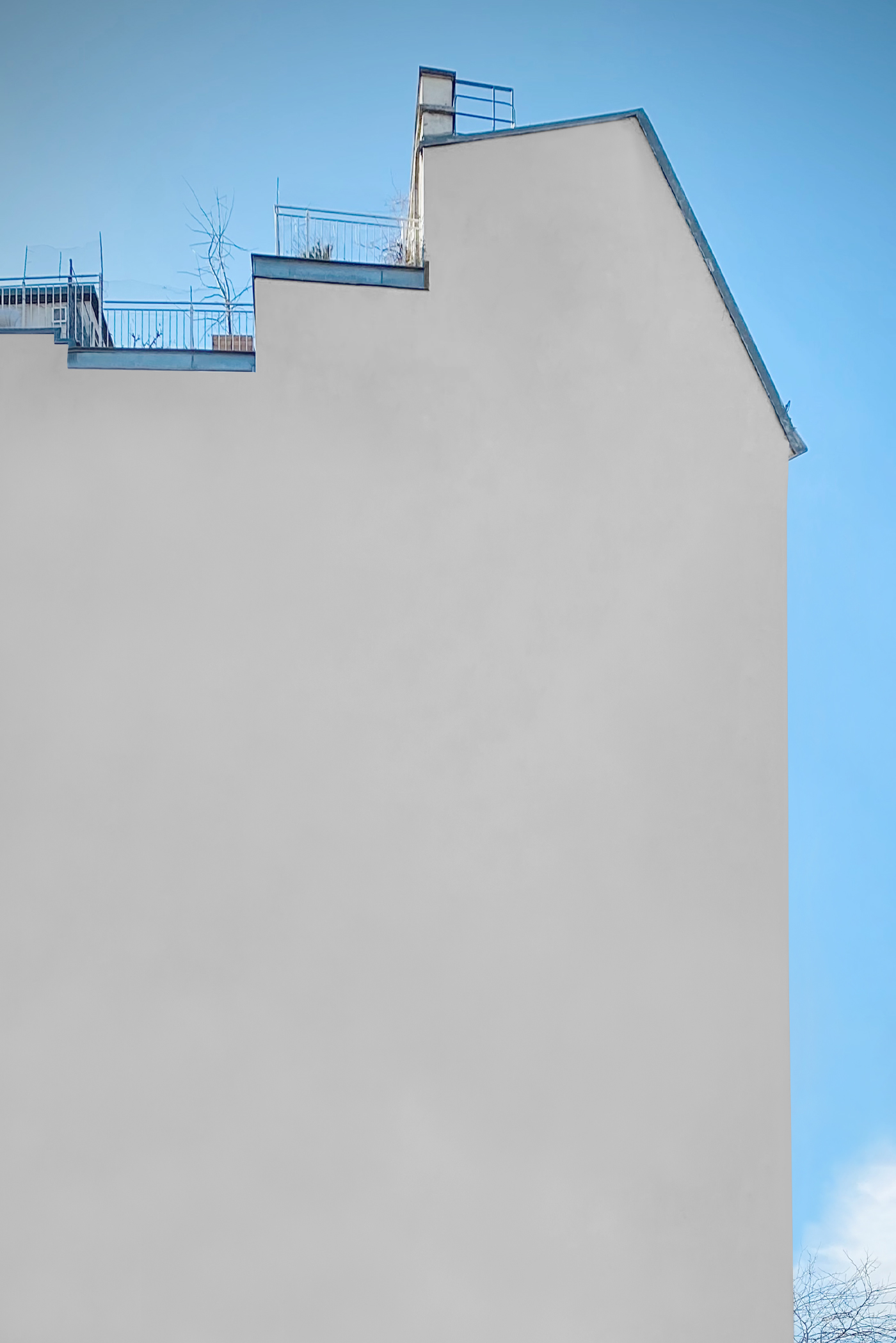Front view, street blank mural mockup with a visible sky behind.