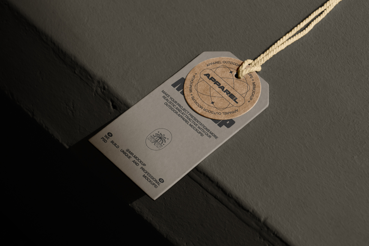 Seen from above, label mockup. One is in dark color and the second is in craft color. Both are laying on the dark color concrete.
