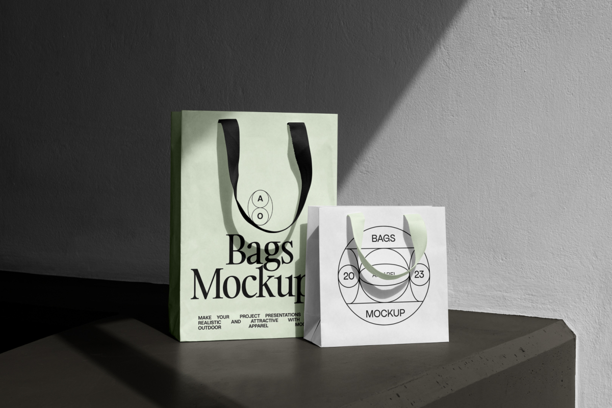 Front view, paper bag mockups standing on the dark beige concrete against on the white wall.