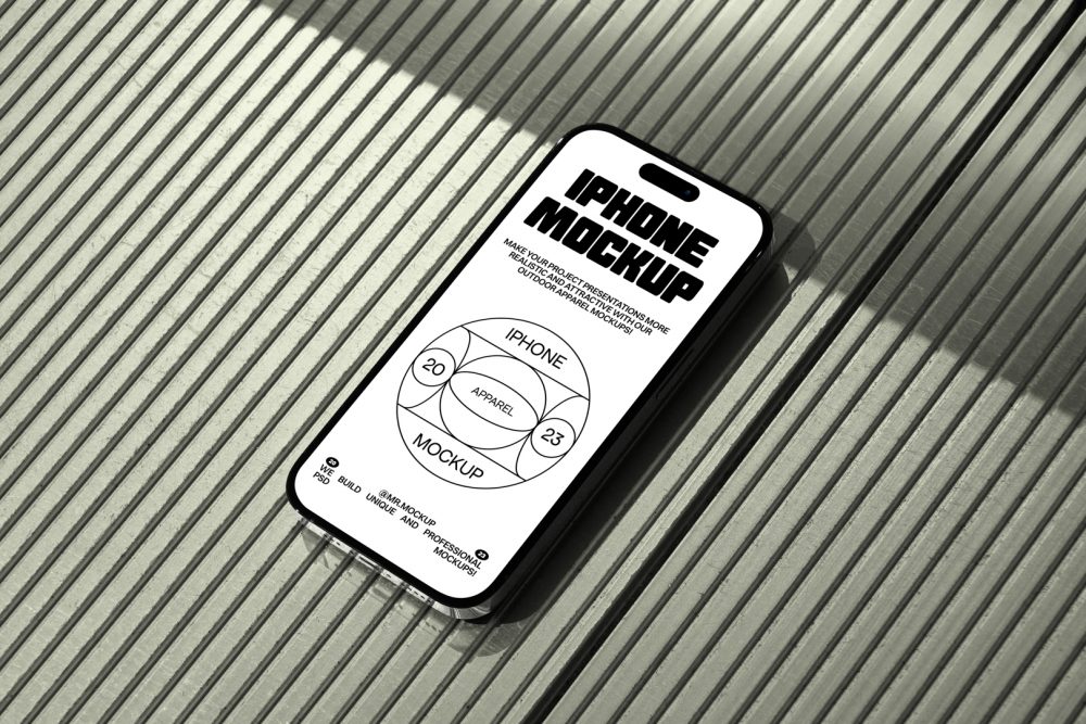 Seen from above, iPhone 14 Pro Mockup with black typographic design and white background laying on the bright green plastic panel background.