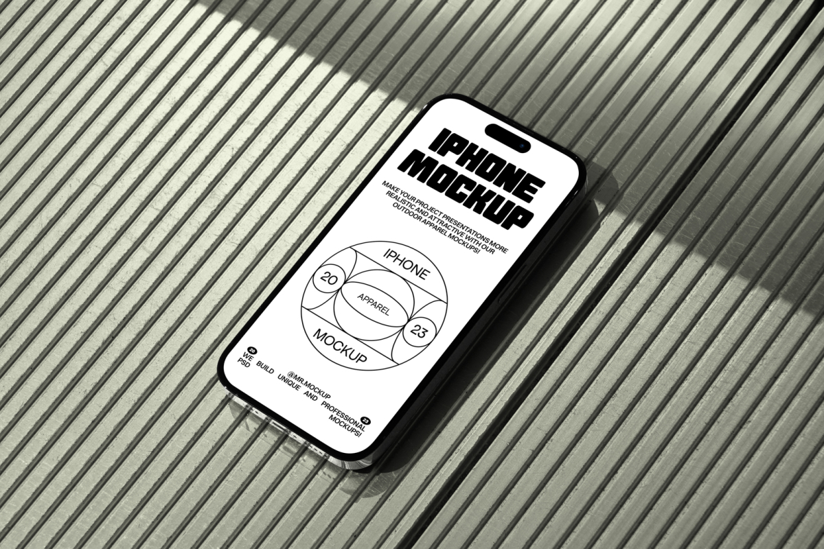 Seen from above, iPhone 14 Pro Mockup with black typographic design and white background laying on the bright green plastic panel background.