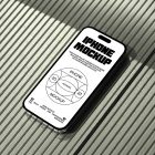 Seen from above, iPhone 14 Pro Mockup with black typographic design and white background laying on the bright green plastic panel background.