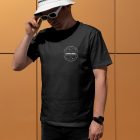Front view, a man wearing a white black T-shirt Mockup and a white Bucket Hat Mockup standing against on the gold wall.