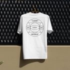 Front view, white T-Shirt Mockup with a black typographic logo on it hanging on an orange hanger attached to a black fence.