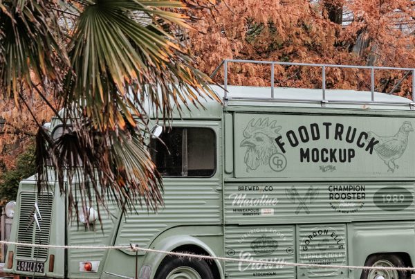 Front view, vintage Citroën foodtruck mockup standing in parking between nature.