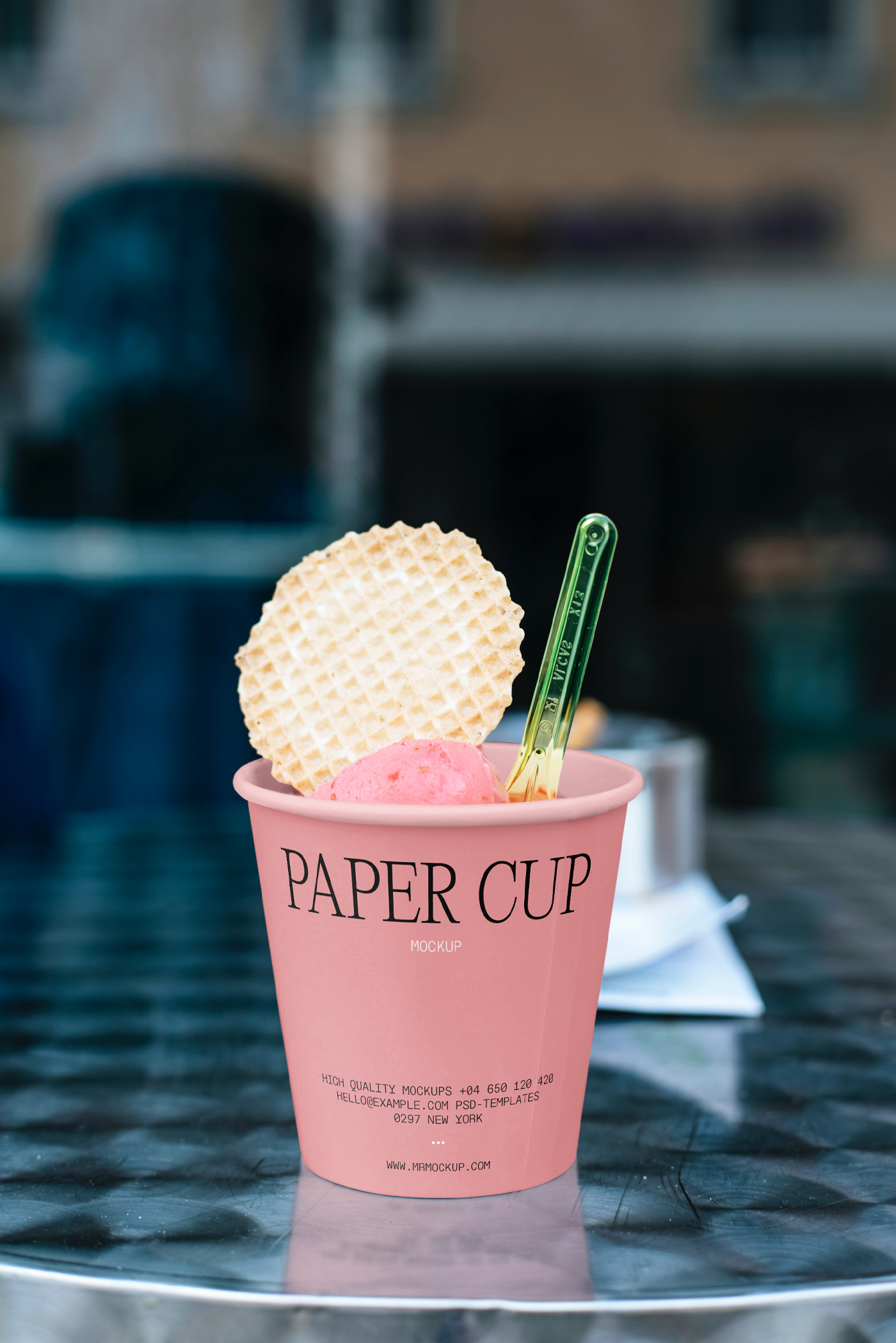 Front view, ice cream paper cup mockup standing on the metal table.