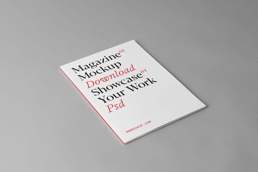 A4 magazine mockup laying on the gray floor.