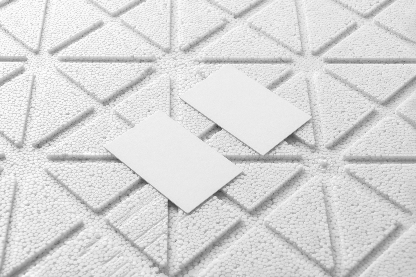 View from above, blank business card mockup laying on the white styrofoam.