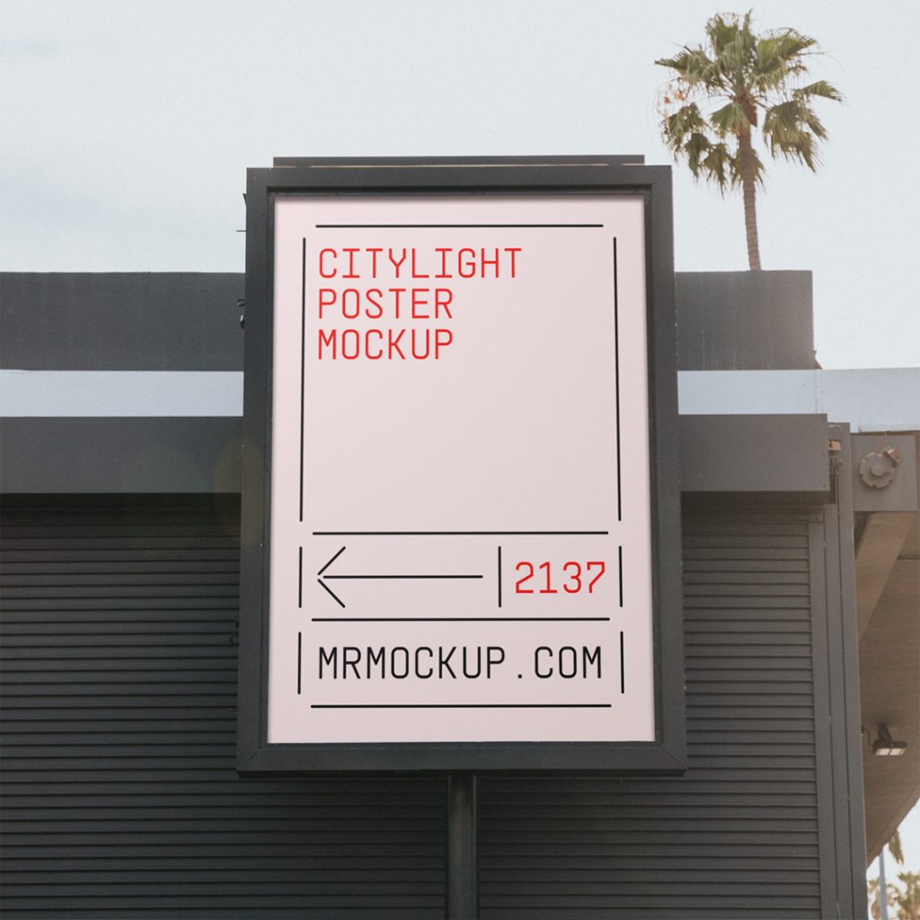 Front view, citylght poster mockup with black metal frame in front of the building and visible sky behind.