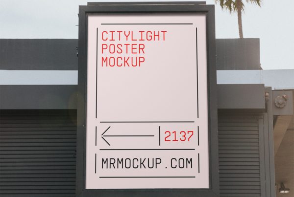 Front view, citylght poster mockup with black metal frame in front of the building and visible sky behind.