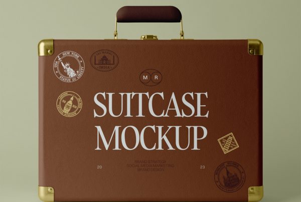 Front view, vintage brown suitcase mockup laying on the green color floor.