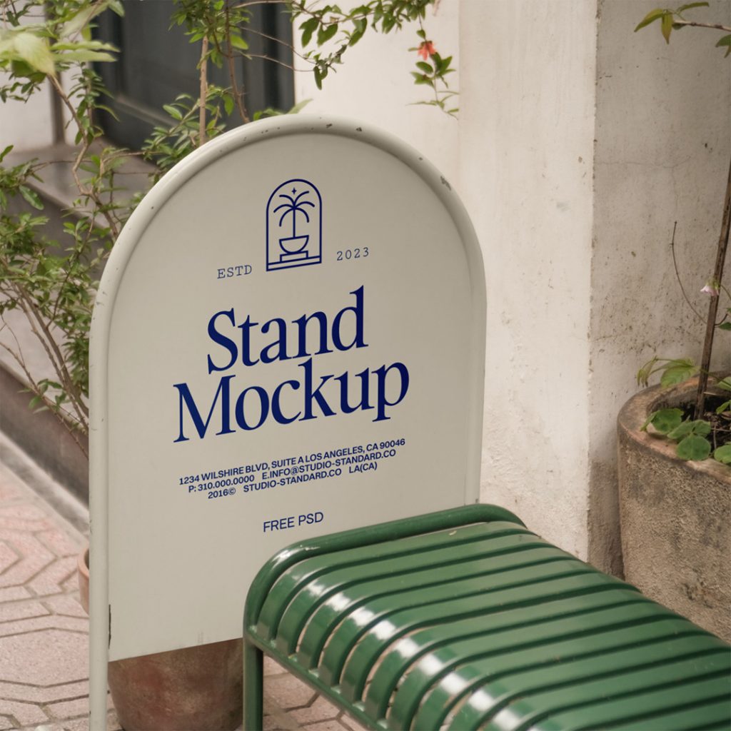 Metallic street stand mockup in front of the building.