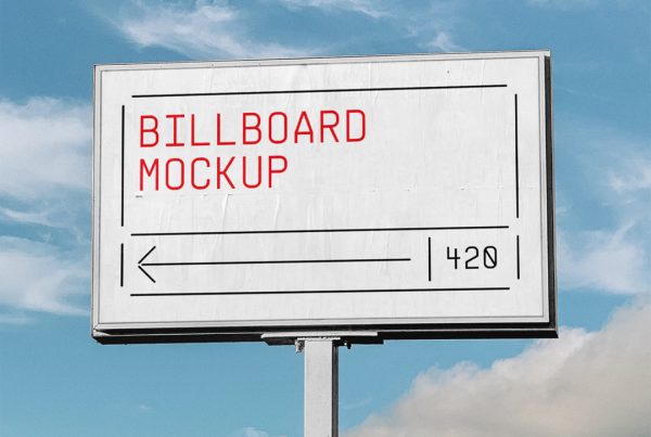 Front view, outdoor billboard mockup with silver frame with visible sky behind.