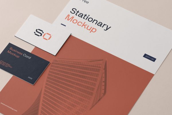View from above, small stationery set mockup laying on the beige floor.