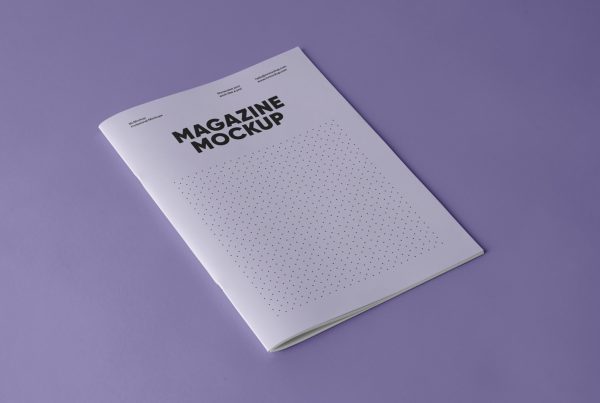 Purple soft cover magazine mockup laying on the purple floor.