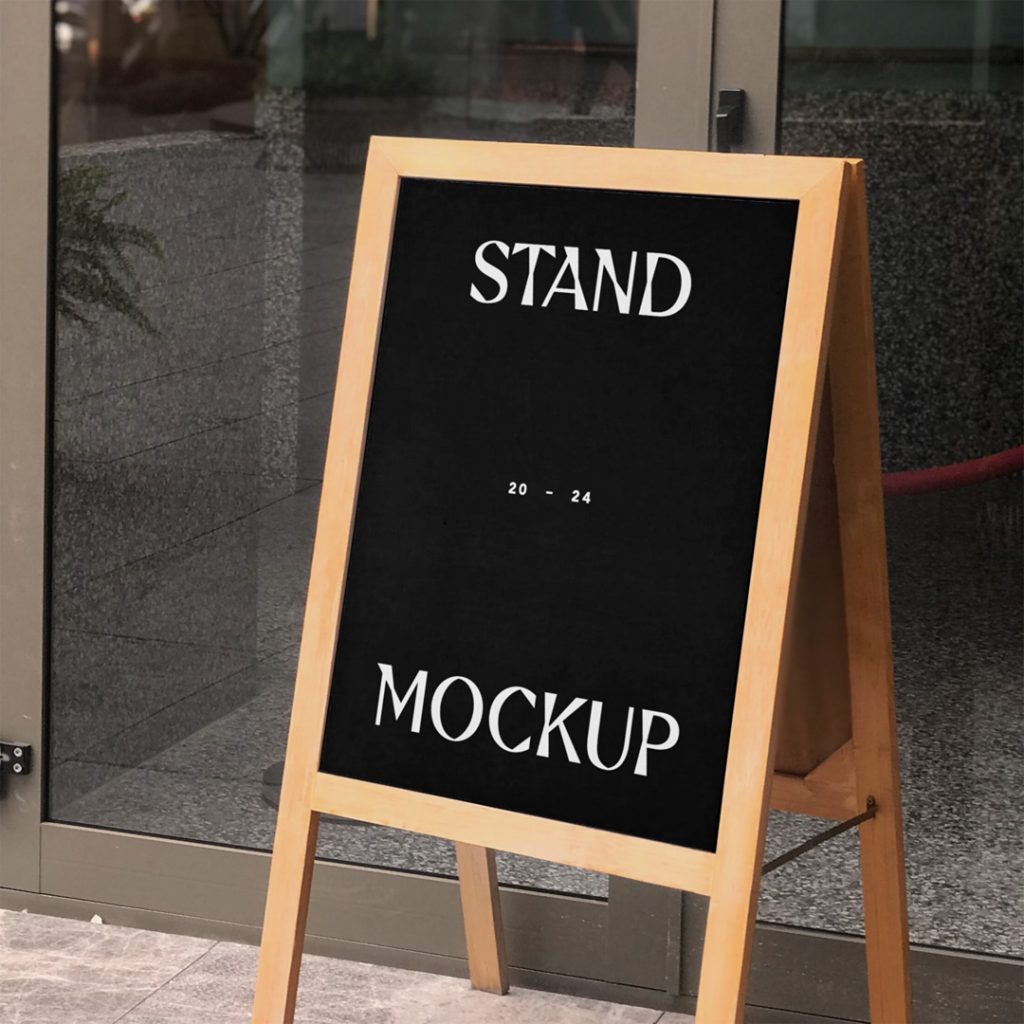 Front view, wooden street stand mockup standing in front of the restaurant.