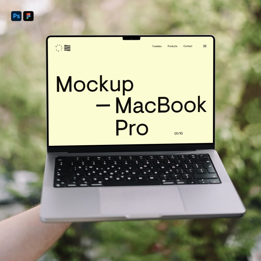 Men holding MacBook Mockup in front of the garden.