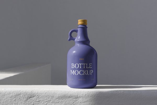 Purple ceramic bottle mockup standing on the concrete wall in front of the gray wall.