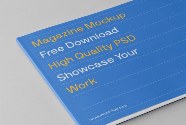 Blue horizontal magazine mockup laying on the gray floor.