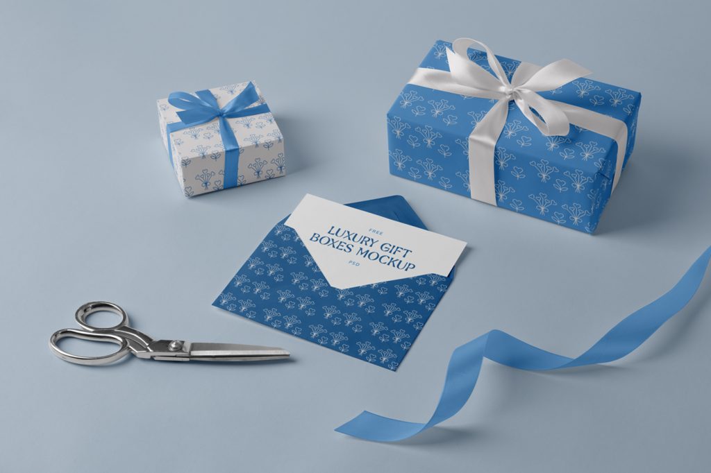 Blue color luxury gift boxes mockup laying on the blue floor.