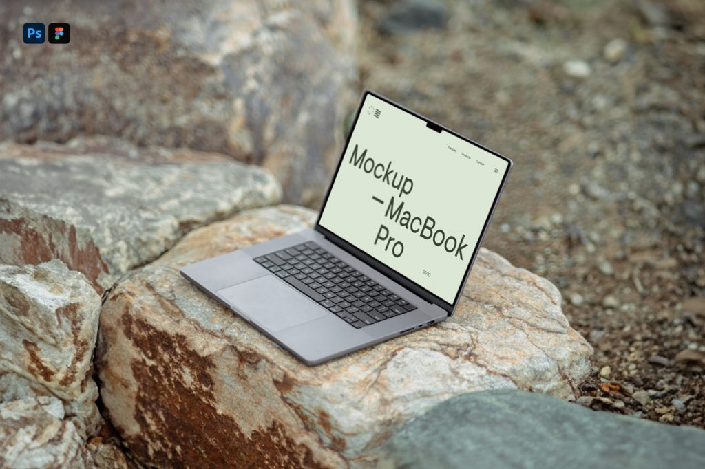 Silver MacBook Mockup standing on a stone surface.
