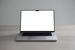 Free Silver MacBook Pro on Desk Mockup — Mr.Mockup