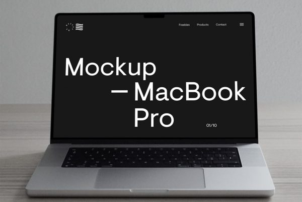 Front view, Silver MacBook Pro Mockup laying on the wooden floor.