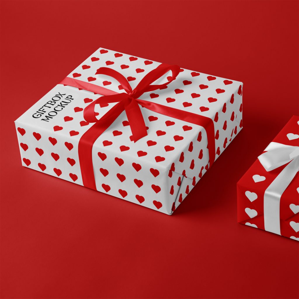 Valentine's gift boxes mockup with ribbon laying on the red floor.