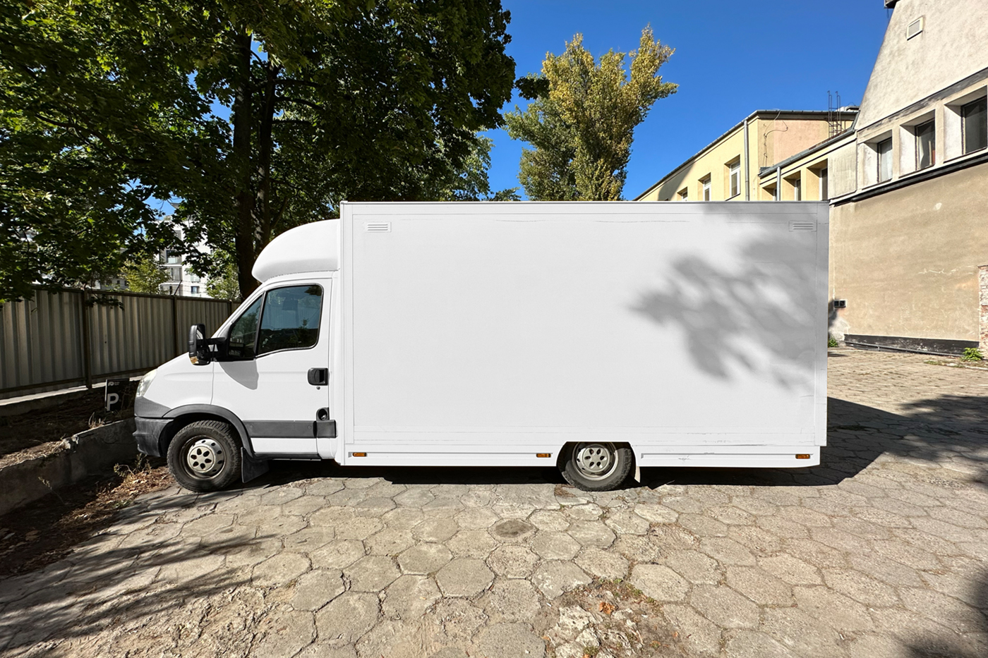 White vehicle mockup standing in the parking.