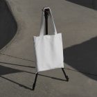 Canvas bag hanging on tripod from outdoor apparel mockups vol.2.