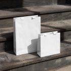 Two paper bags on the stairs from outdoor apparel mockups vol.2.