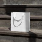 Small paper bag on the stairs from outdoor apparel mockups vol.2.