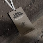 Brown paper tag laying on big concrete stairs.