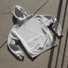 Hoodie laying on concrete floor from outdoor apparel mockups vol.2.