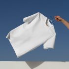 Man holding white t-shirt with hanger form outdoor apparel mockups vol.2.