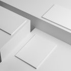 Three a4 white magazines on the three white cubes scene from studio magazine mockups.