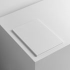White a4 magazine cover on white cube from studio magazine mockups.