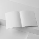 Open white a4 magazine on cubes from studio magazine mockups.