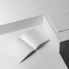 Two blank square mgazines on white cubes from studio magazine mockups.