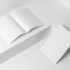 Two a4 blank magazines on white cubes from studio magazine mockups.
