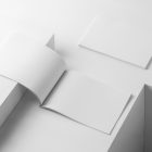 Two horizontal blank magazines on white cubes from studio magazine mockups.