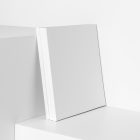 Three square blank magazines on white cubes from studio magazine mockups.