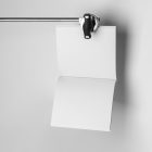 Open white square magazine hanging on tripod from studio magazine mockups.