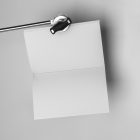 Open white a4 magazine hanging on tripod from studio magazine mockups.