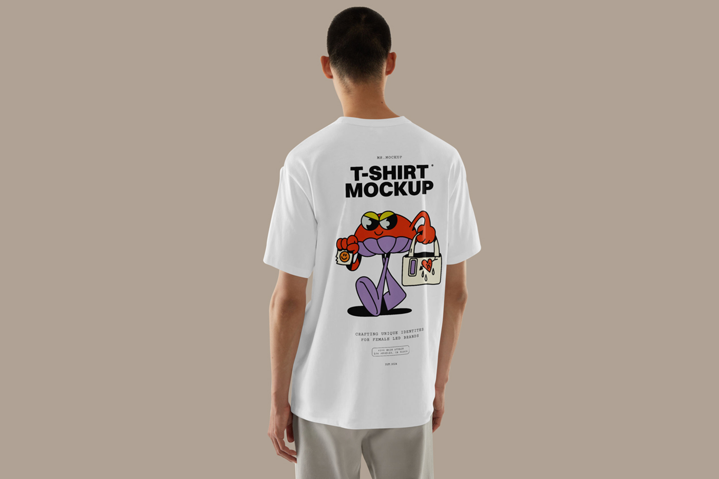 Men standing backwards wearing t-shirt mockup with a colorful logo design in front of the beige wall.